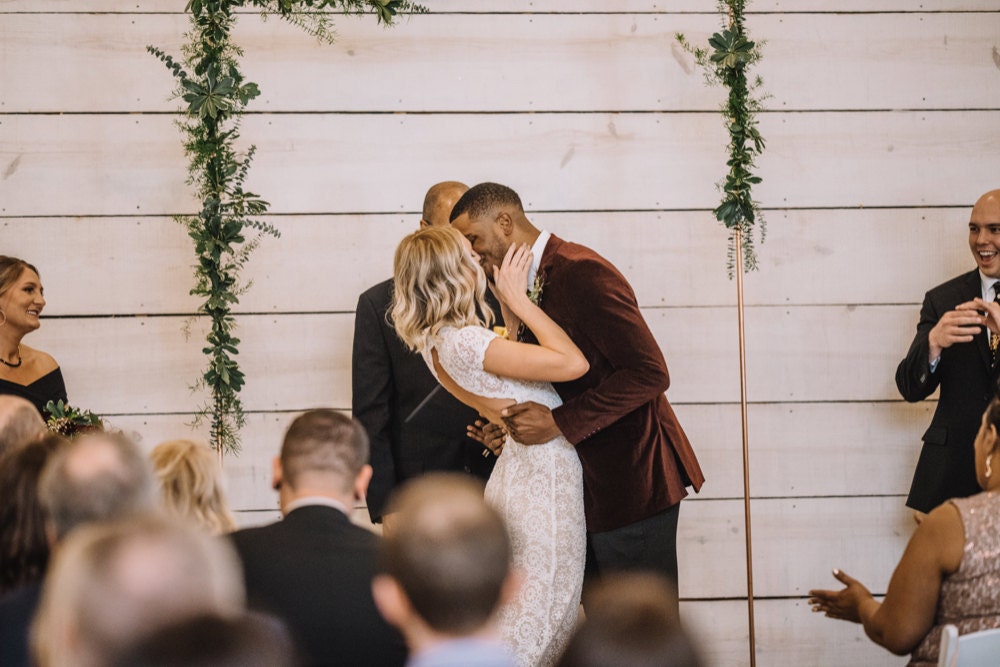 Emily and Terrell have their first kiss as husband and wife