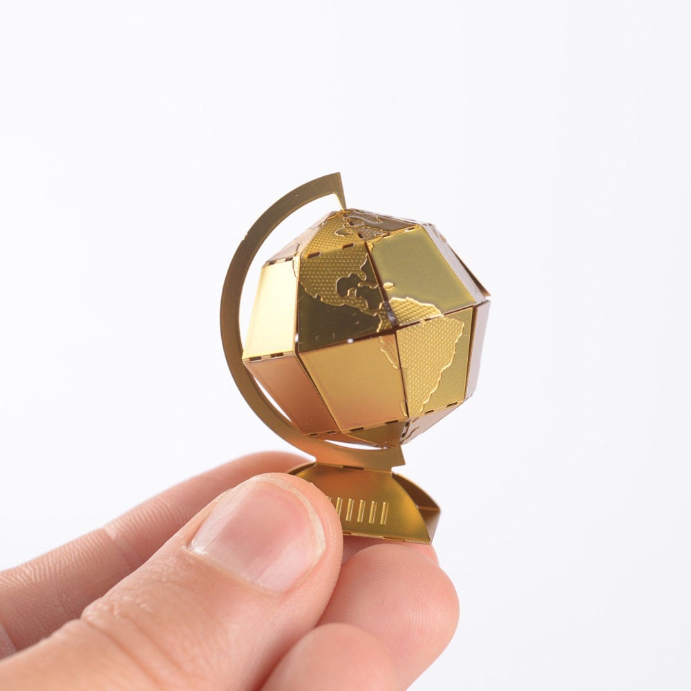 A miniature brass globe model kit from Another Studio.