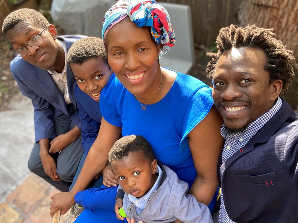 A portrait of Engineering Director Taofeek Rabiu, his wife, and his 3 boys.