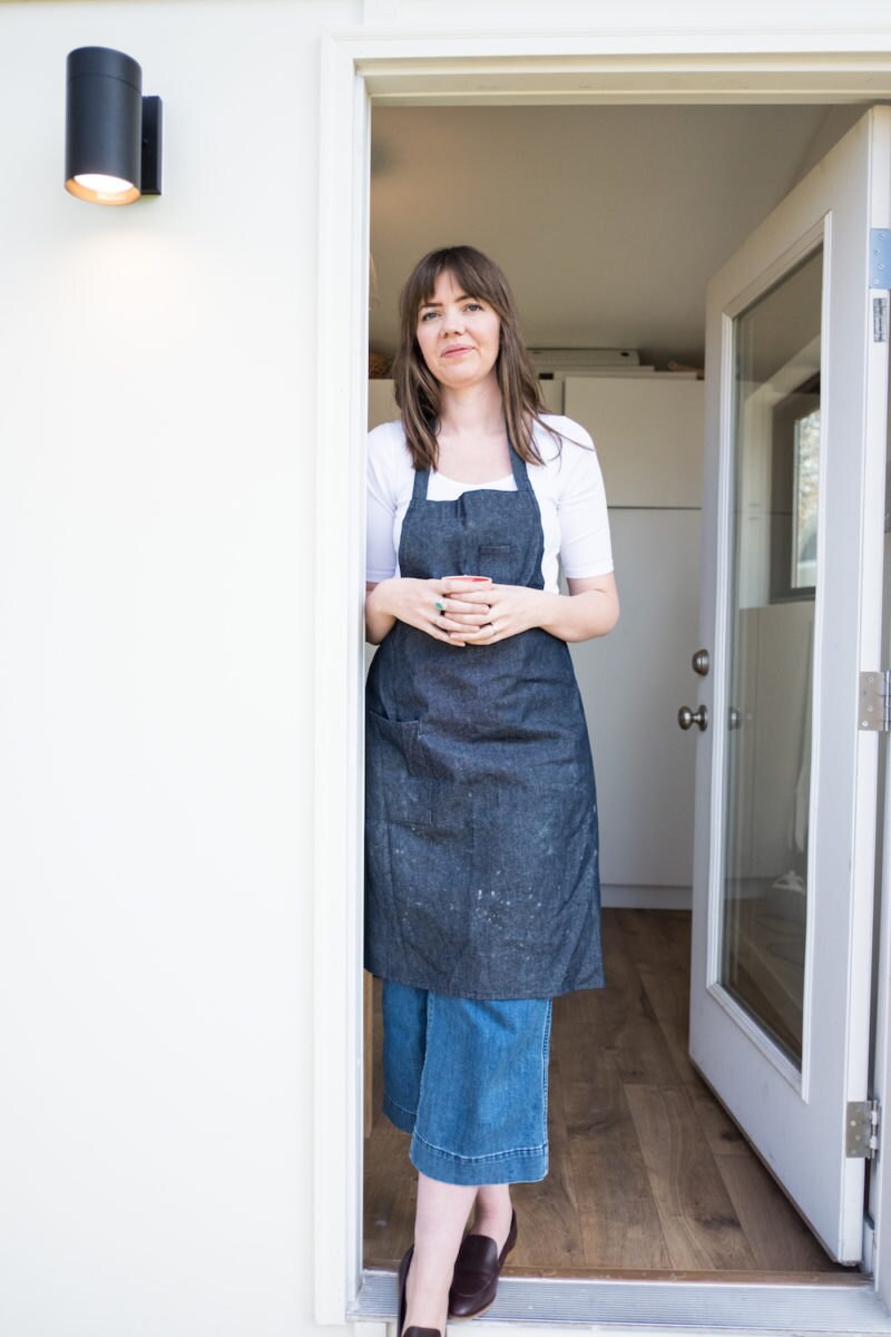 Sarah posing in her studio door