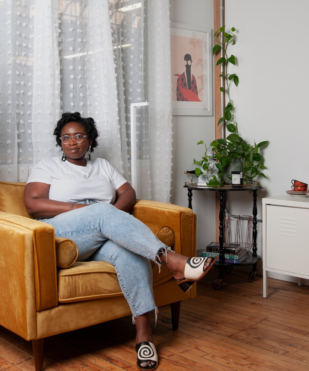 A portrait of Meena in her home.