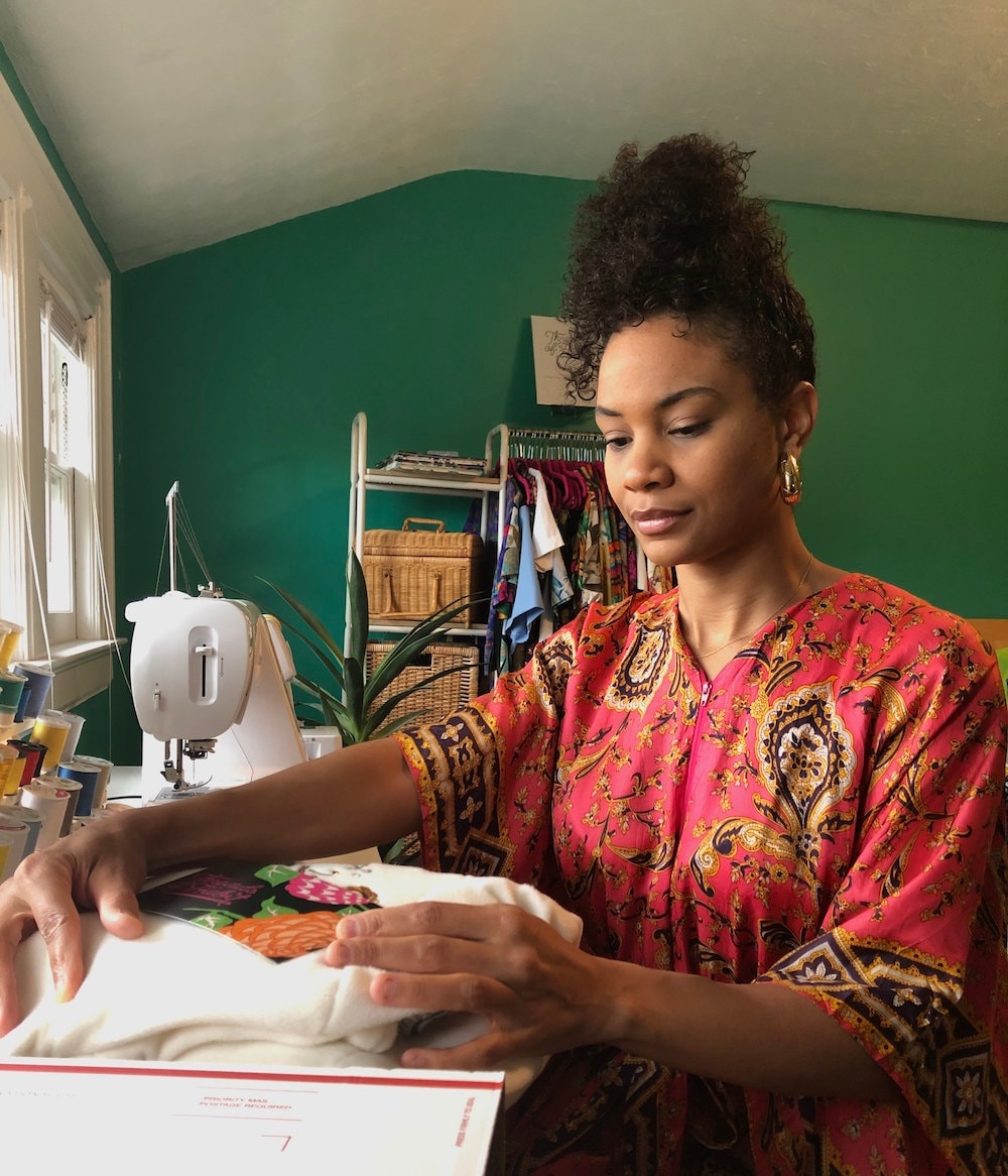 Halima packaging orders in her New Jersey work space.