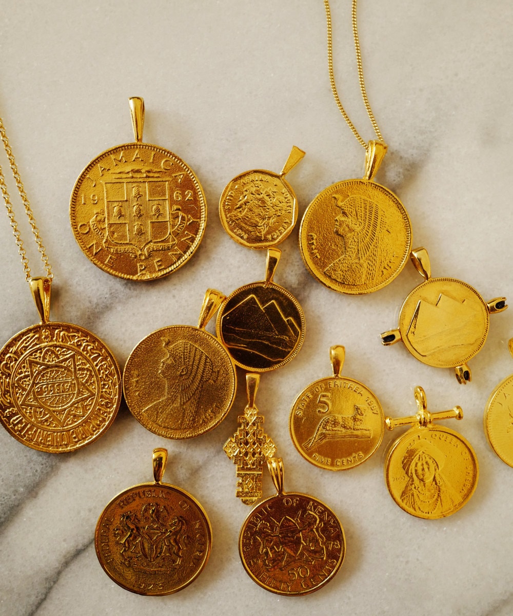 Assorted African gold coin pendants from Omi Woods