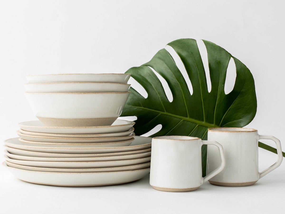 A stack of elegant sand-colored dishes from Convivial Production