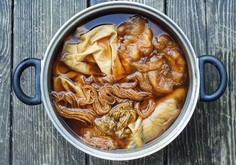 materials soaking in a dye vat