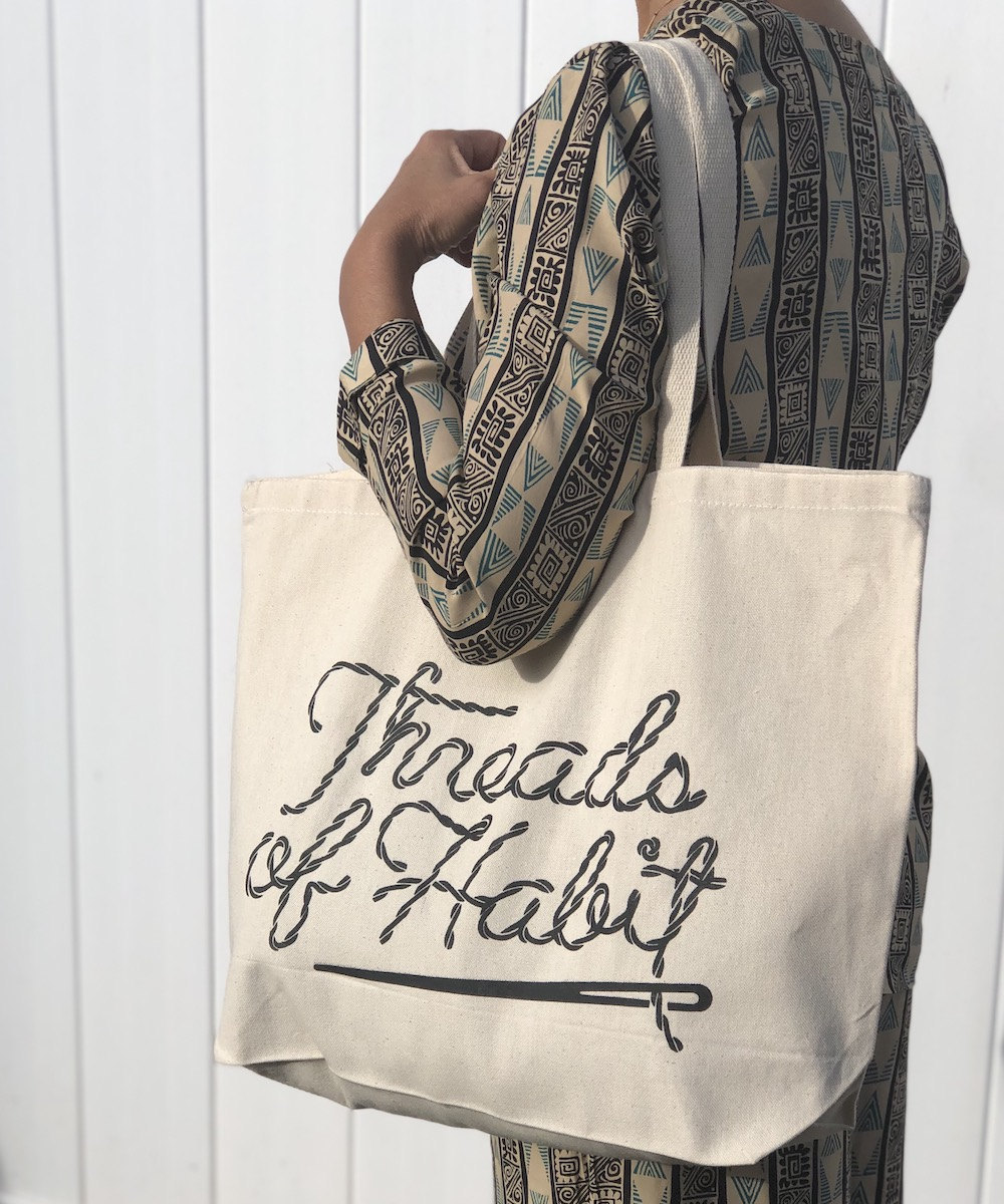 A Threads of Habit canvas tote