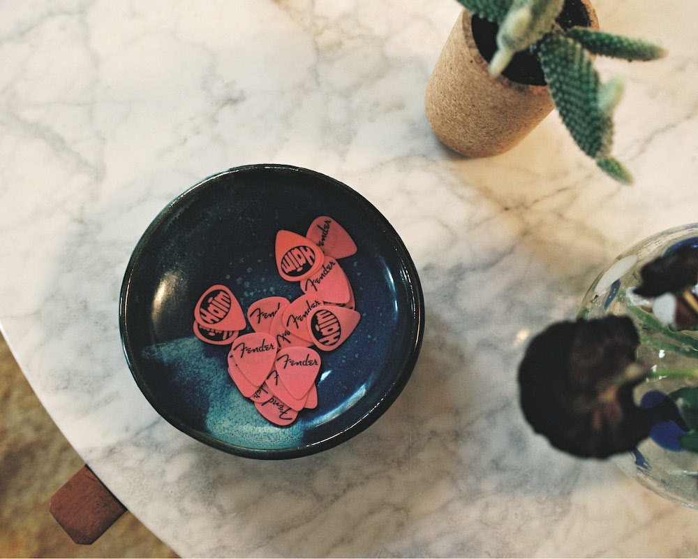 HAIM's guitar picks in a catchall.