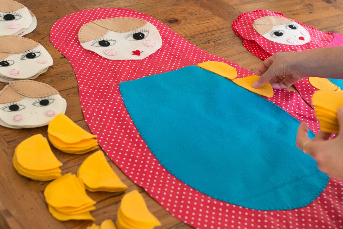 Inbal working on a matryoshka doll costume