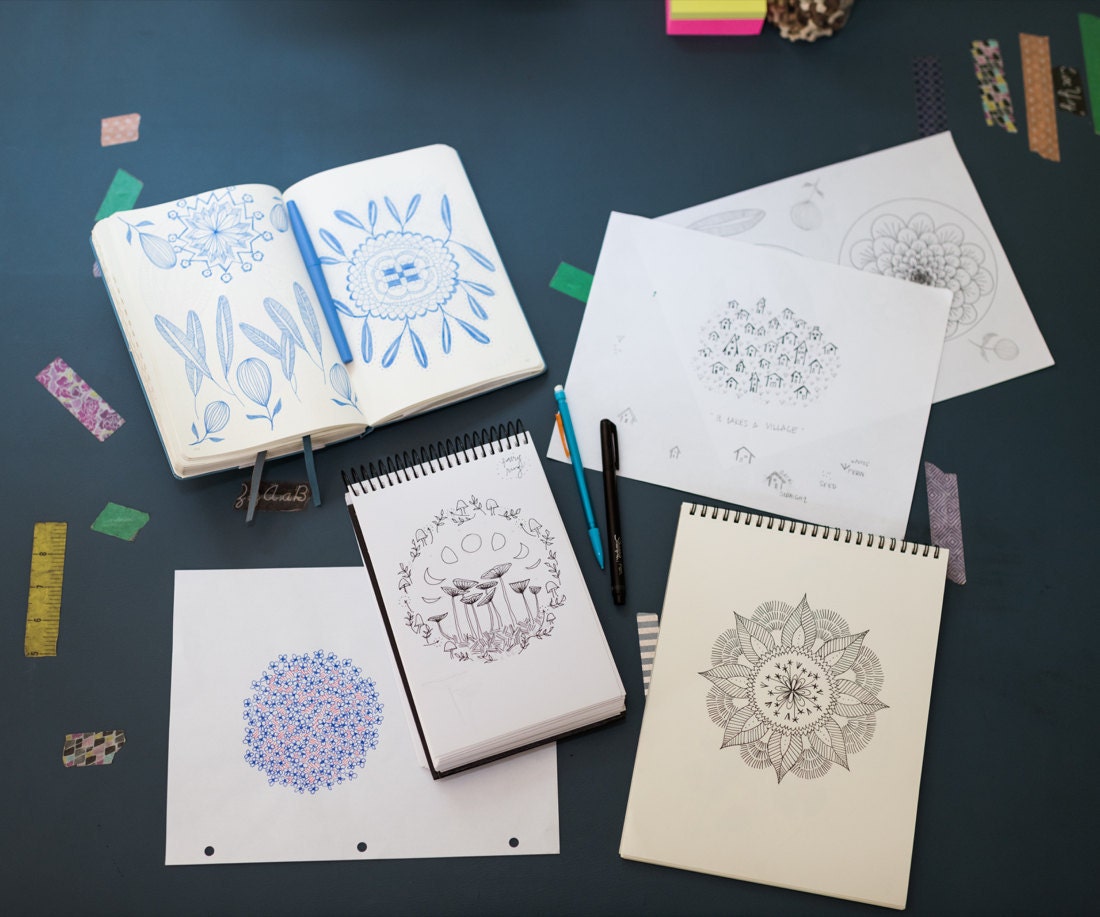 Sketchbooks showing Liz's hand-drawn embroidery pattern designs