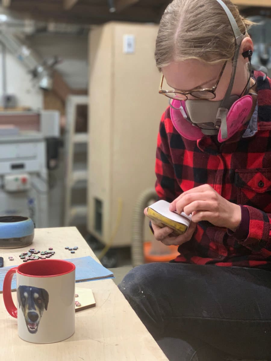 Anne at work on her jewelry designs in the AdrianMartinus woodworking studio.