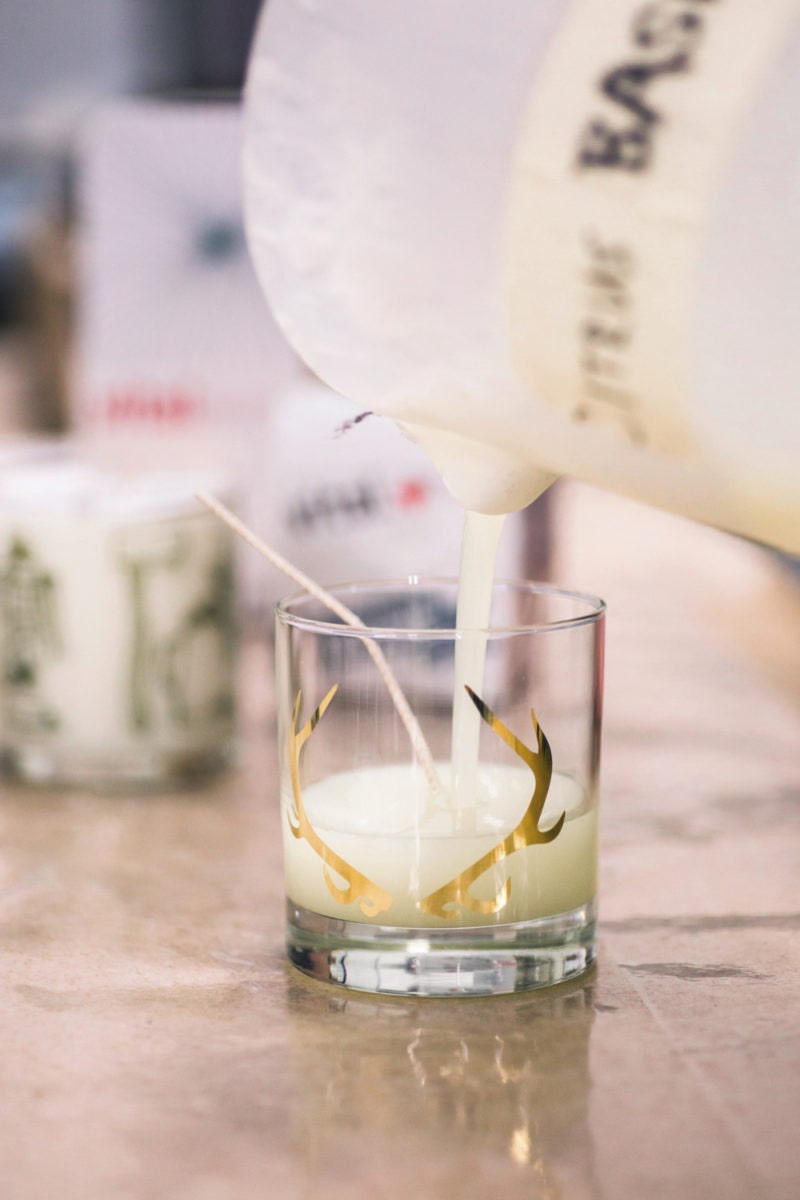 Pouring wax into an antler candle.