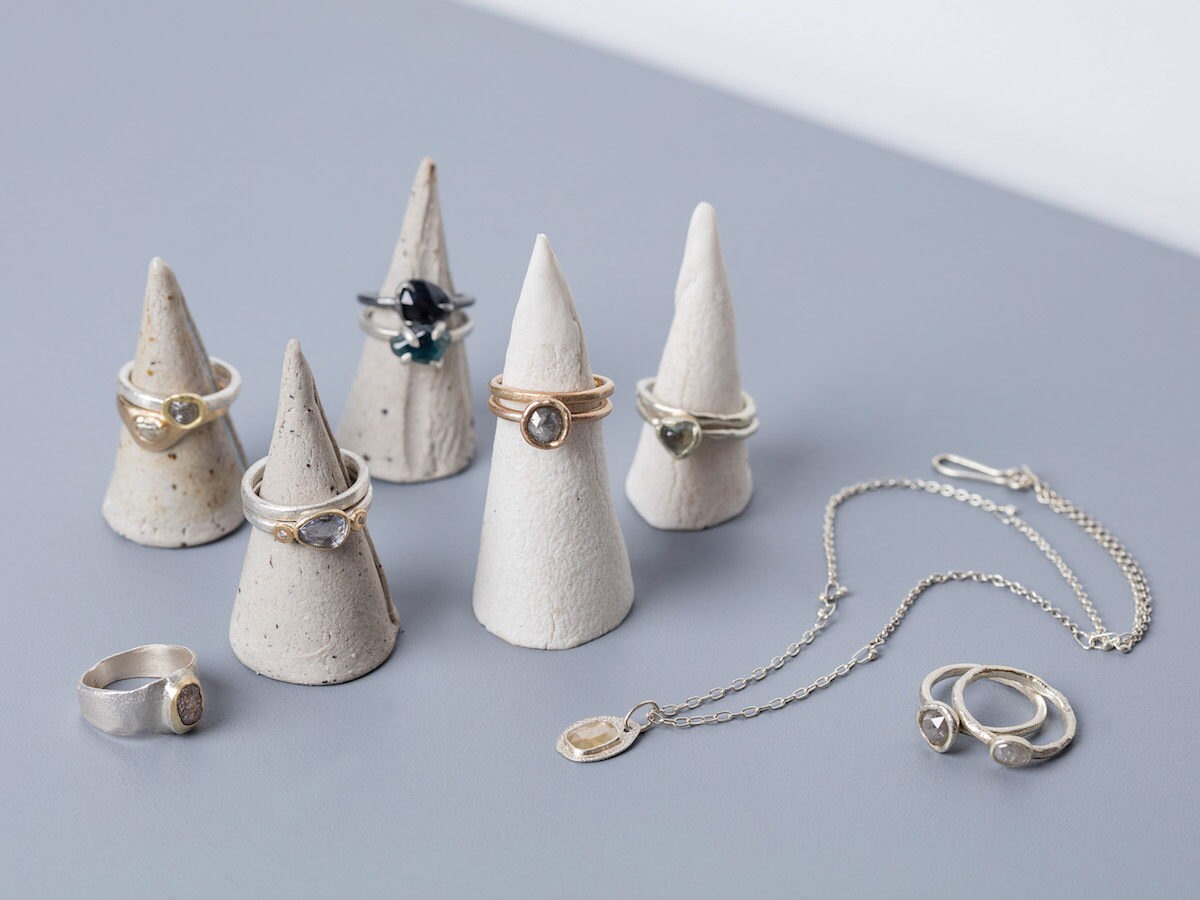 Assorted rings and necklaces from Tamara Gomez on display