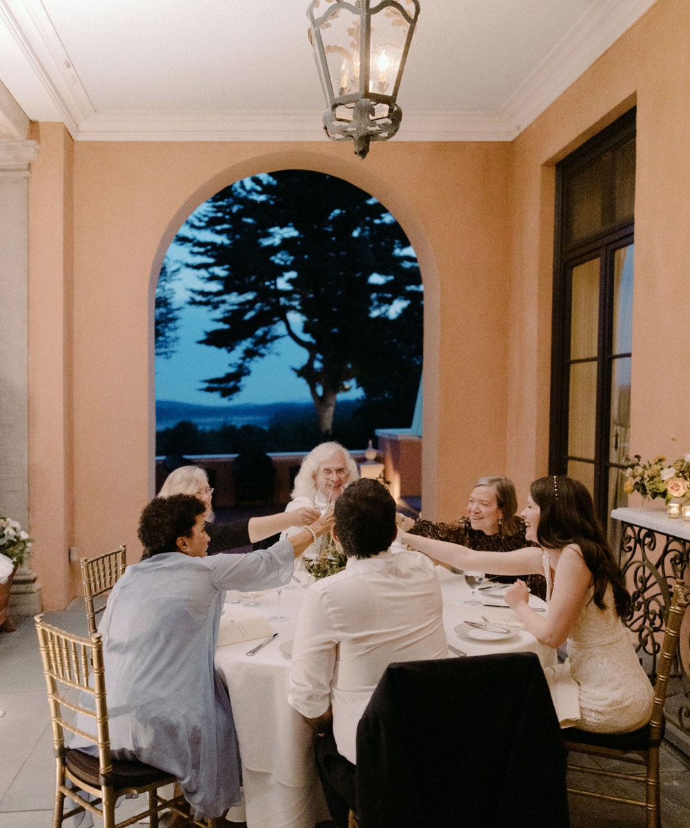 Megan and Imran and their parents enjoy dinner and drinks on the terrace.