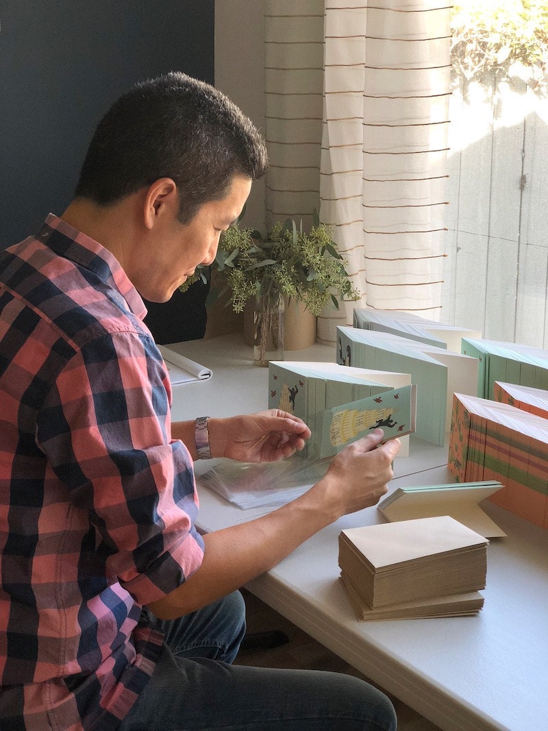 Jim working on packaging cards Jim working on packaging cards