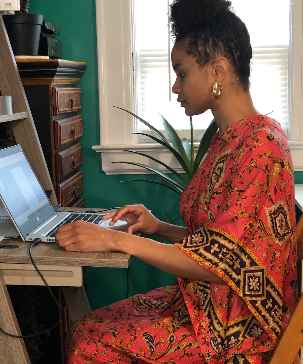 Halima fulfilling orders at her computer