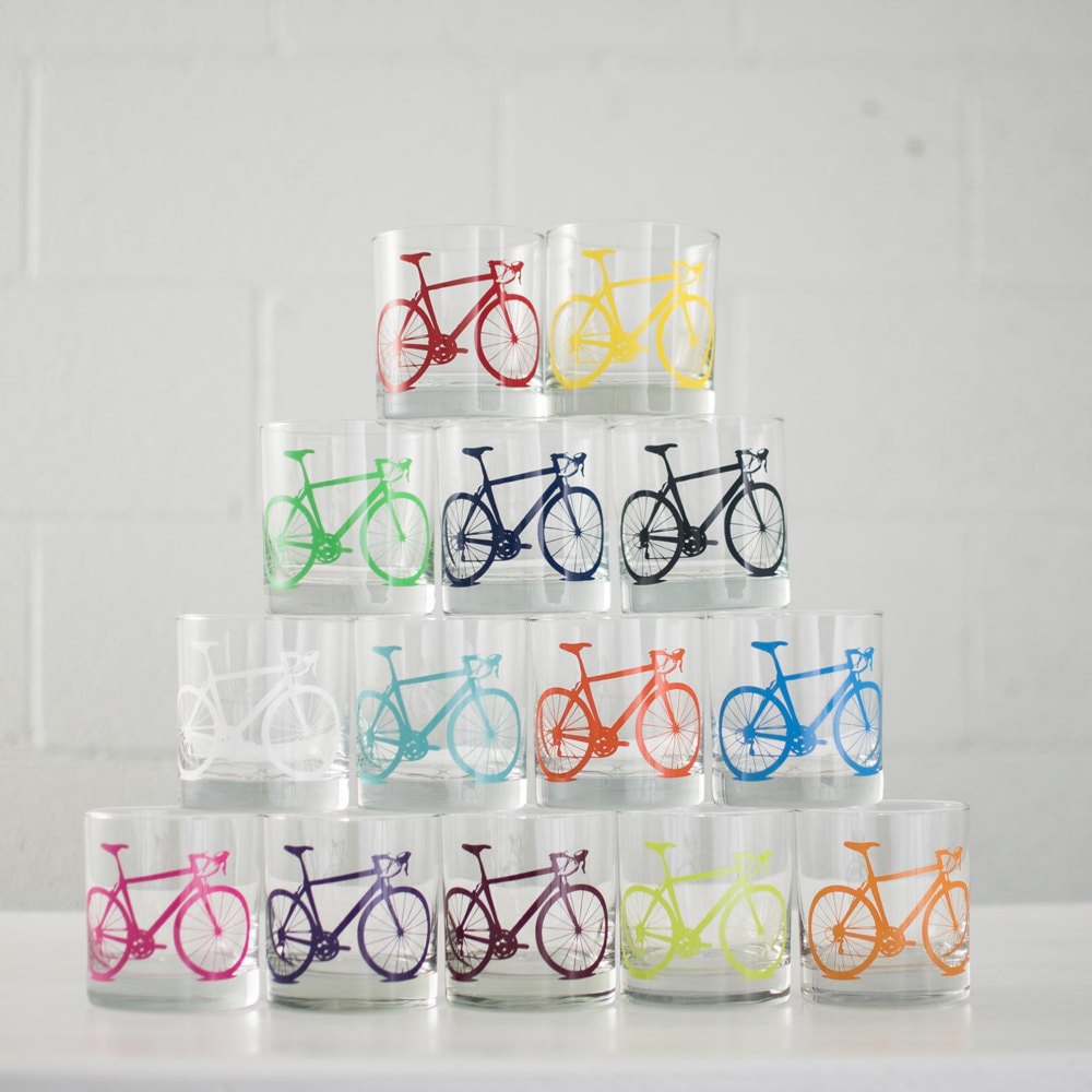 A stack of colorful bicycle highball glasses.