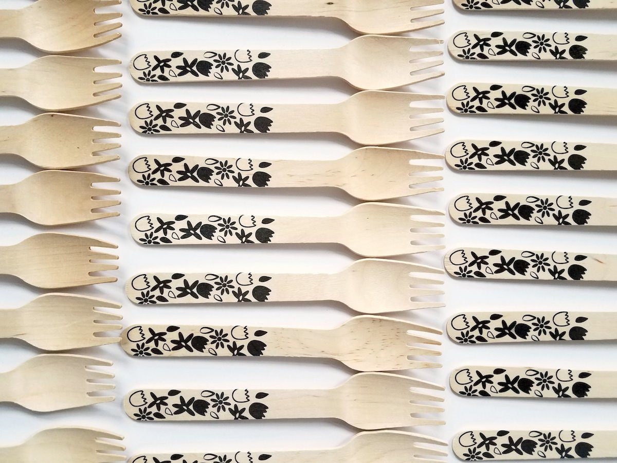 Rows of compostable wooden forks from Sucre Shop