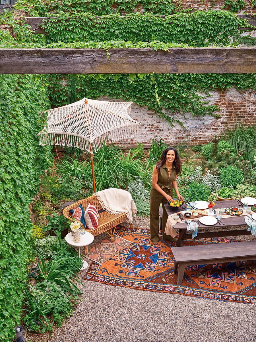 Padma Lakshmi sets the table outside