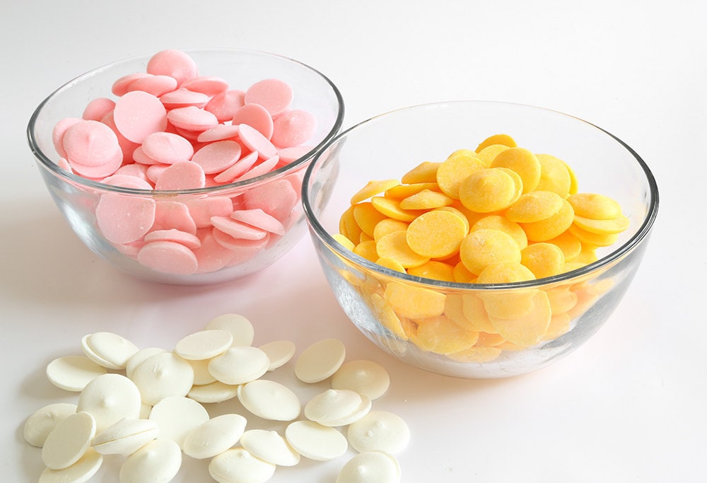 Chocolate melting wafers divided into bowls by color