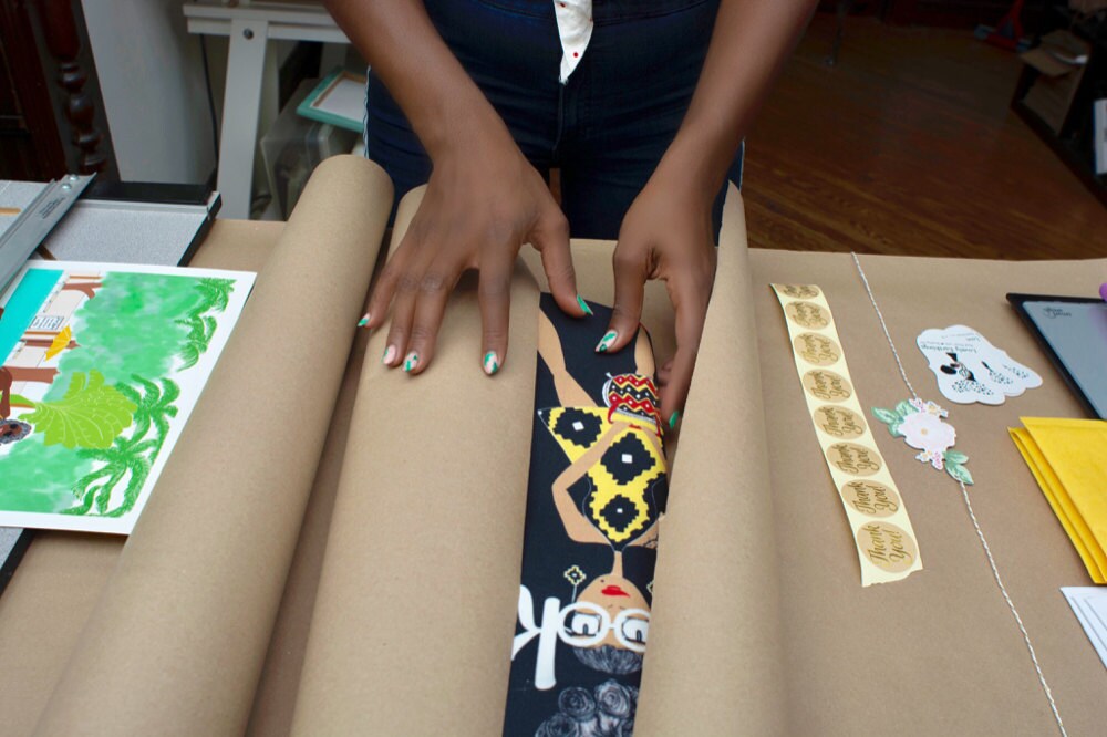 Karina packing up items for shipping Karina packing up items for shipping