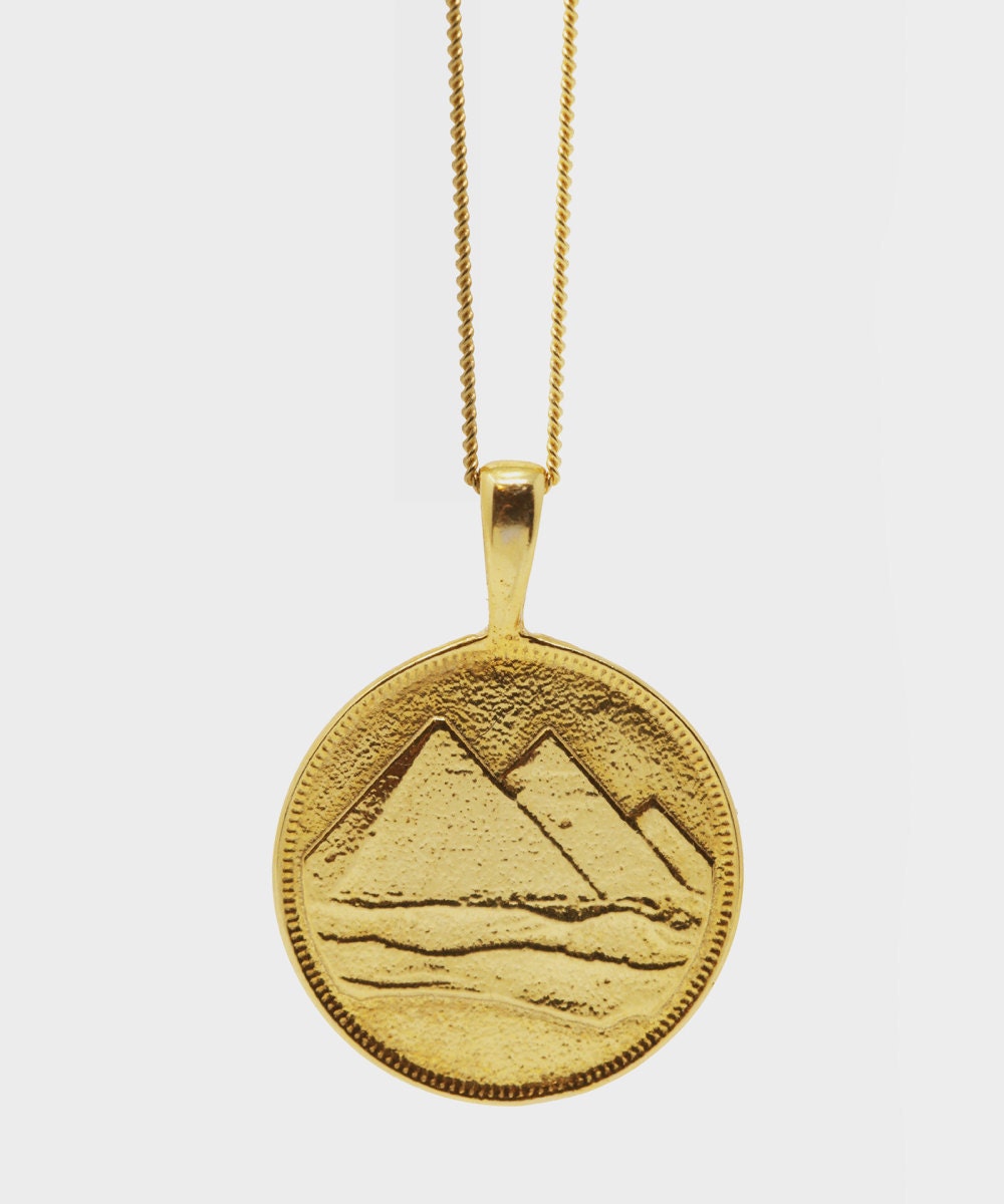 A pyramid charm necklace from Omi Woods