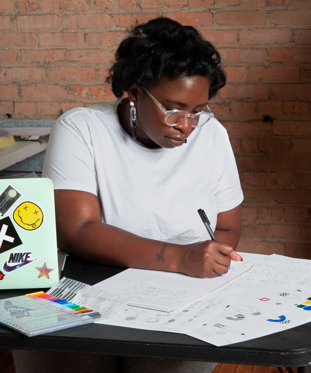 Meena sketching in her Chicago studio.