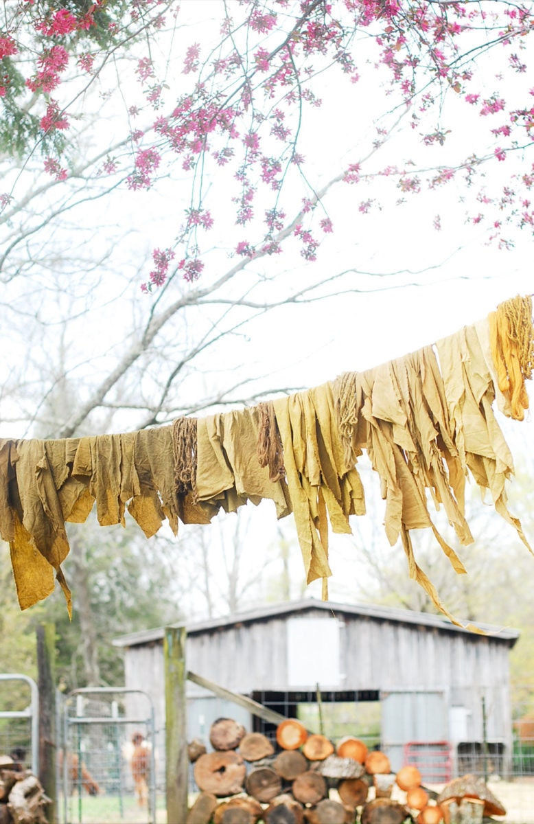 dyed textiles drying on a clothesline