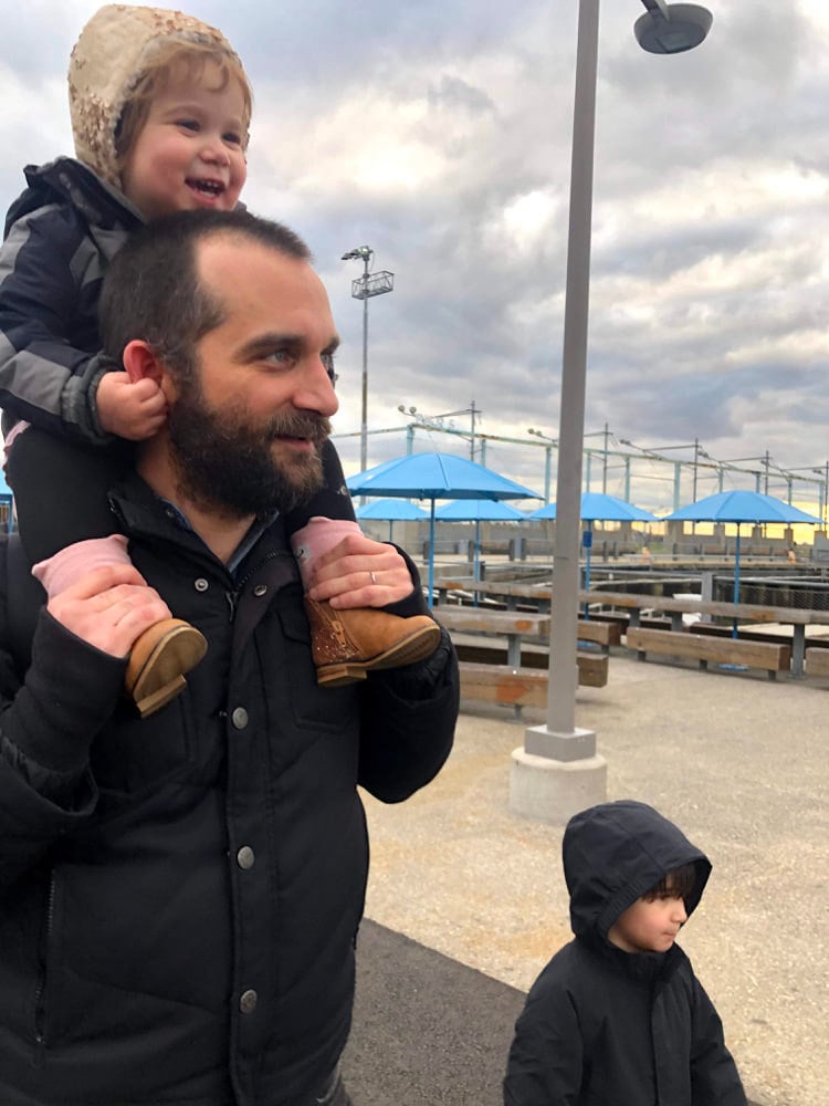 A portrait of Senior Security Engineer Brendan Adamson and his two kids.