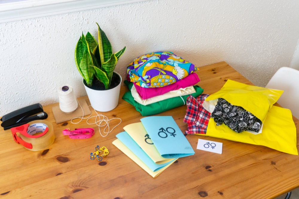 A desk covered in shipping supplies.