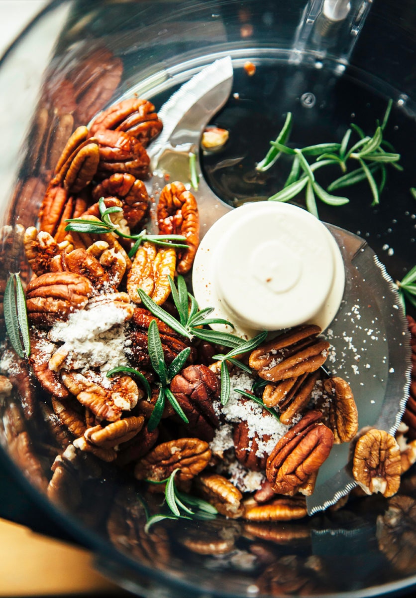Pecans, rosemary, and garlic powder tossed in a food processor