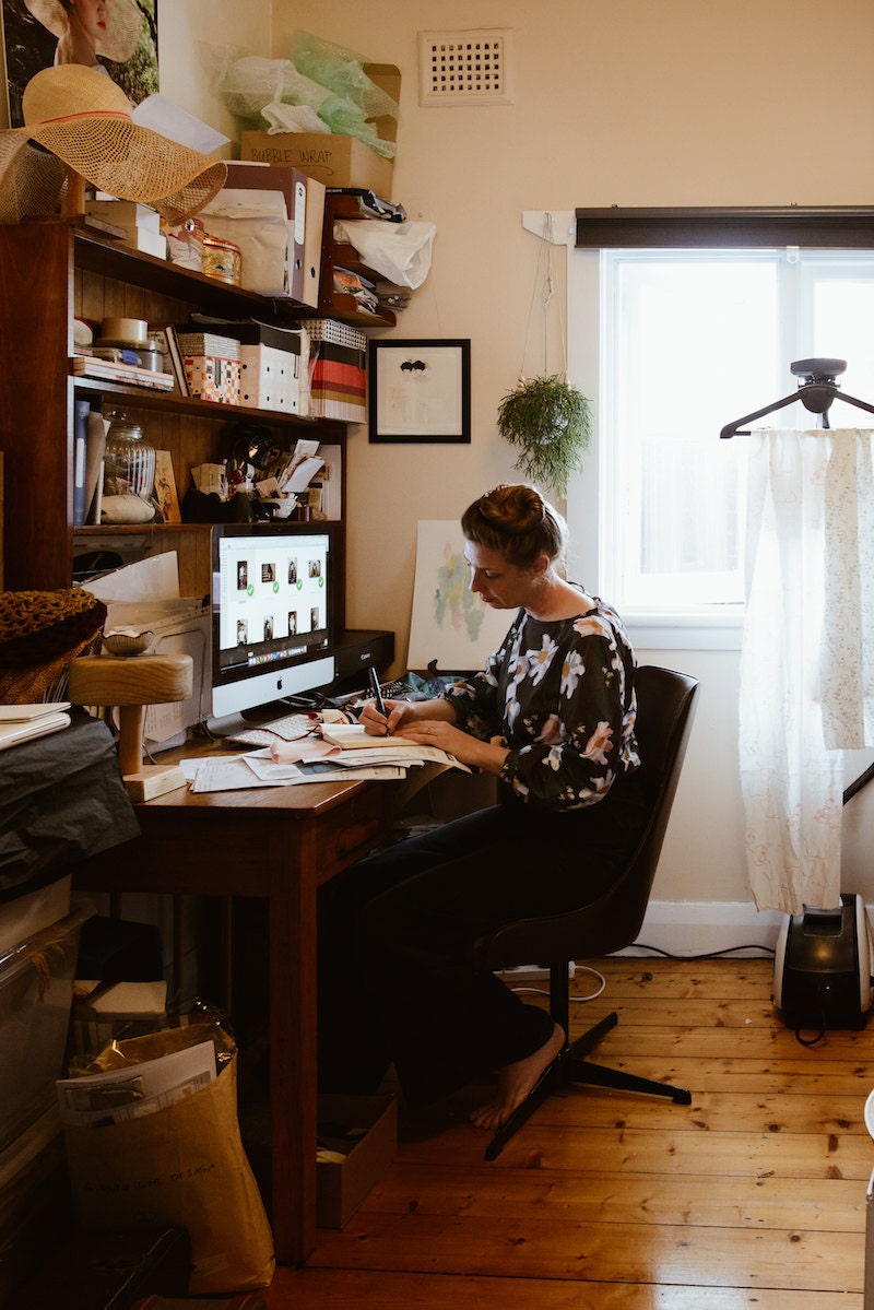 Rabia working at her office computer