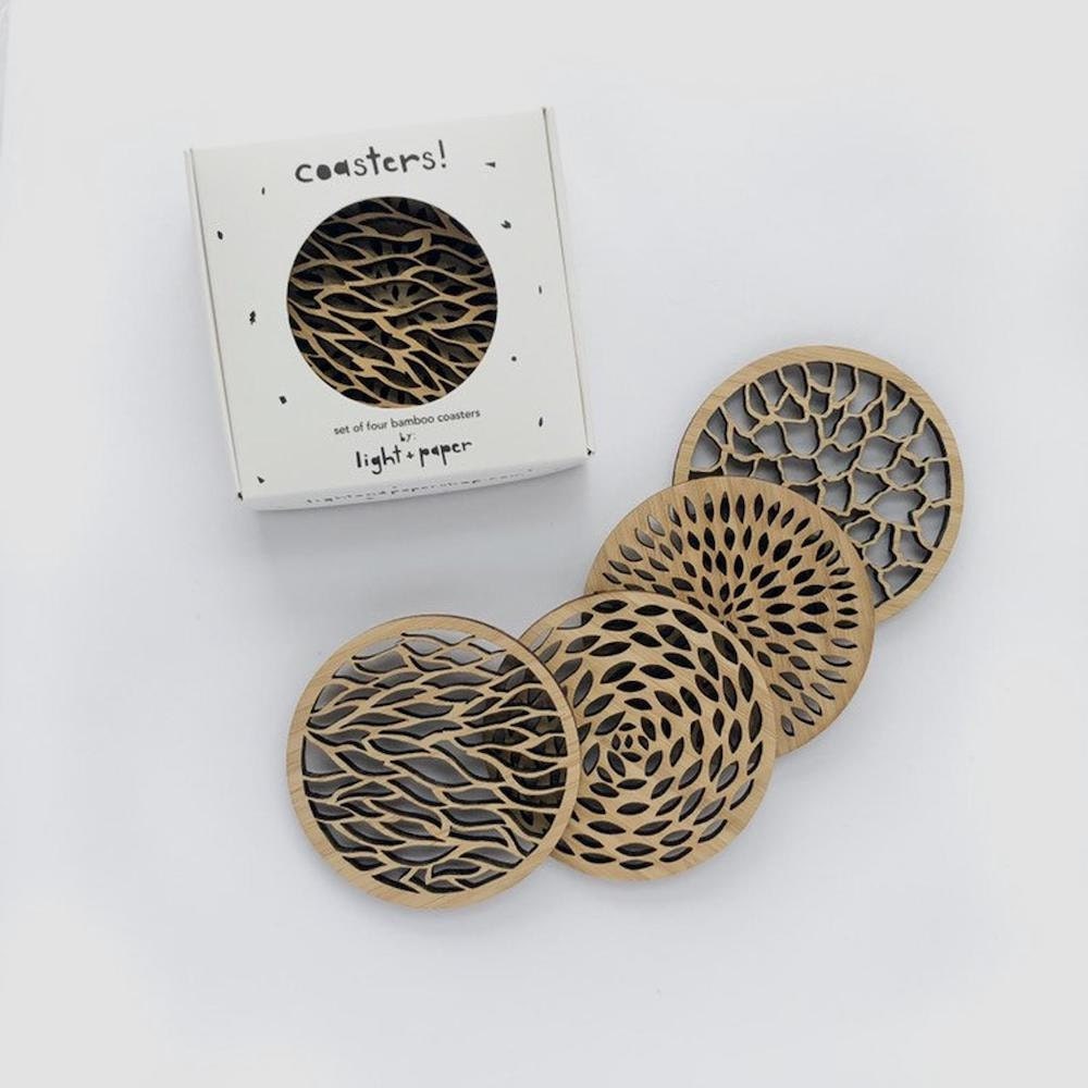 Assorted laser-cut wooden coasters from Light + Paper