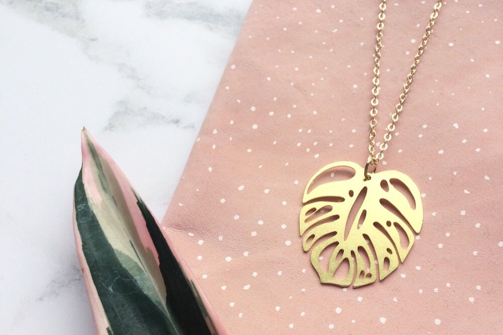Gold monstera leaf necklace from Etsy