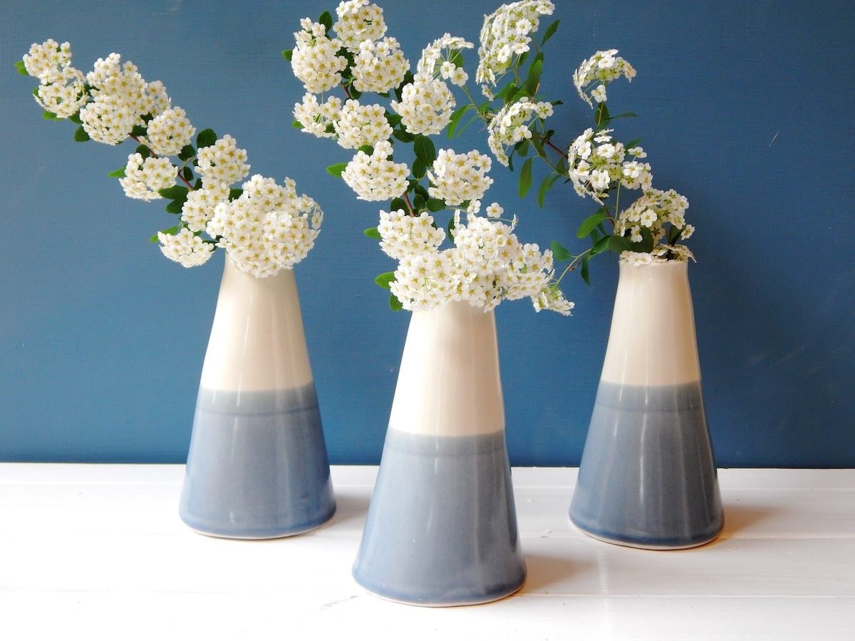 Trio of blue and white vases with white flowers from Lilot Poterie