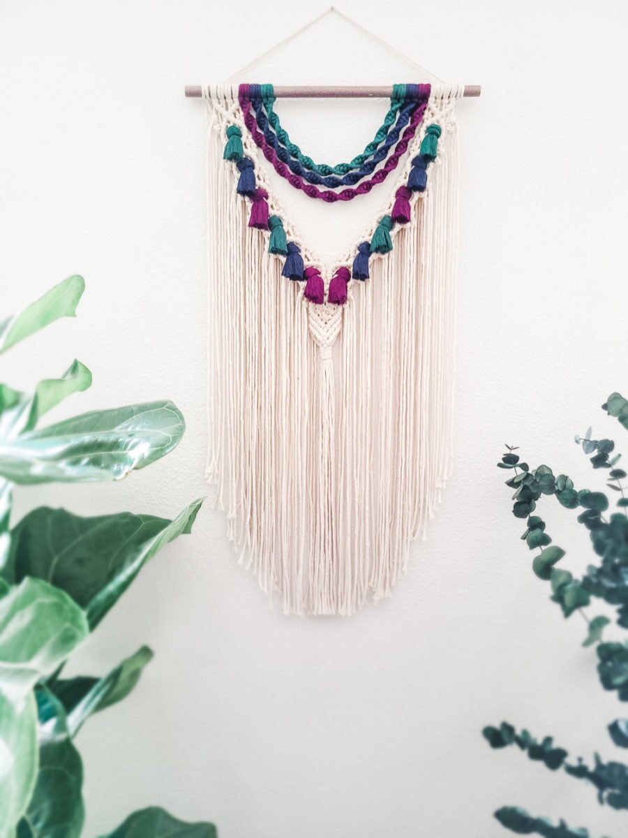 A macrame wall hanging with jewel tones from Sweet Home Alberti