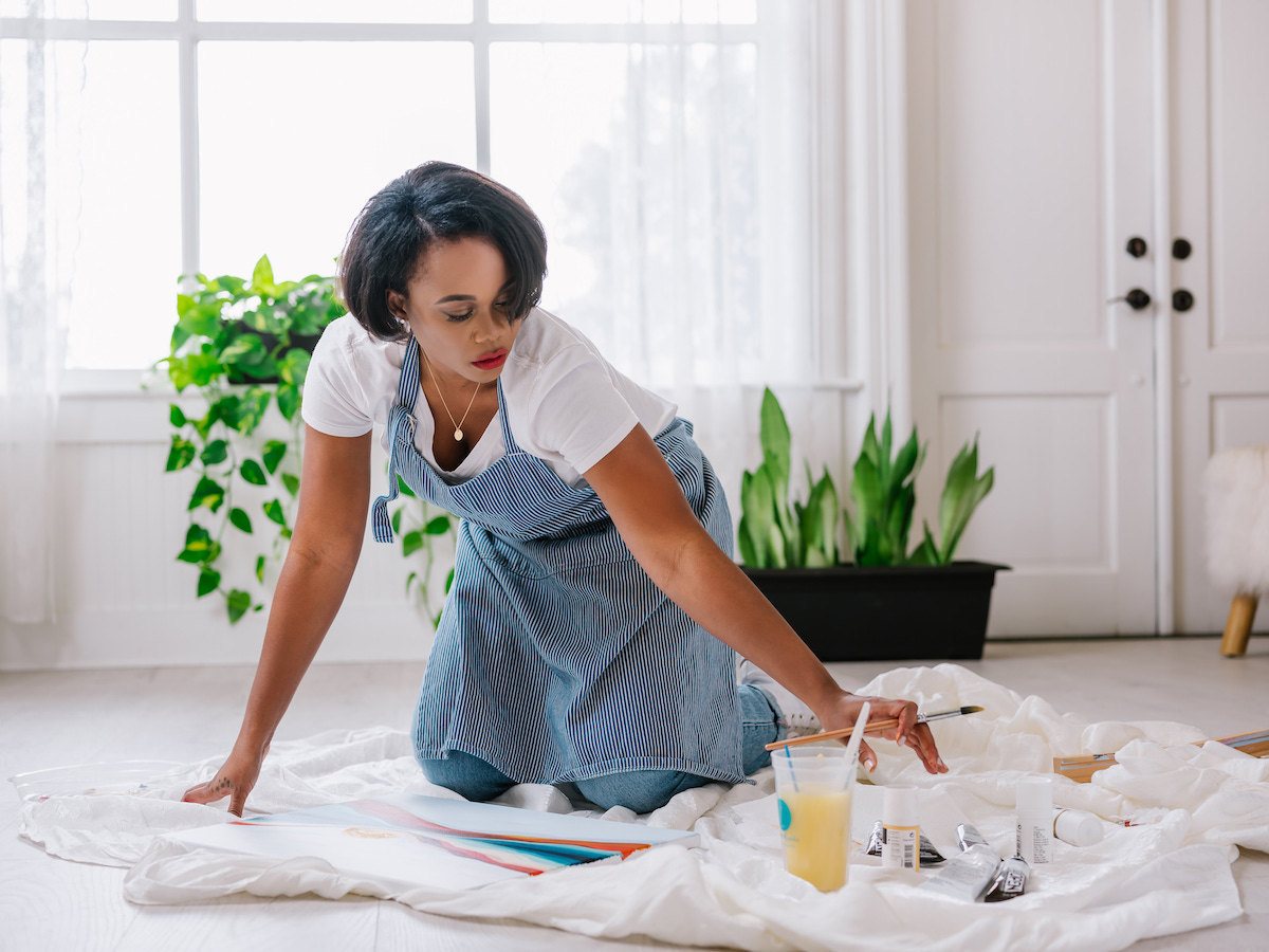 Melissa painting in her studio