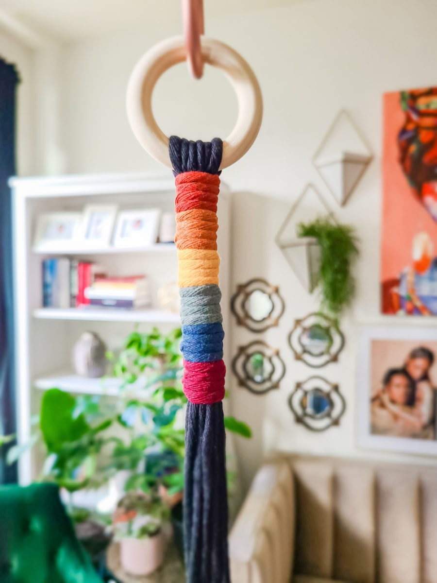 Detail on a rainbow macrame wall hanging from Sweet Home Alberti