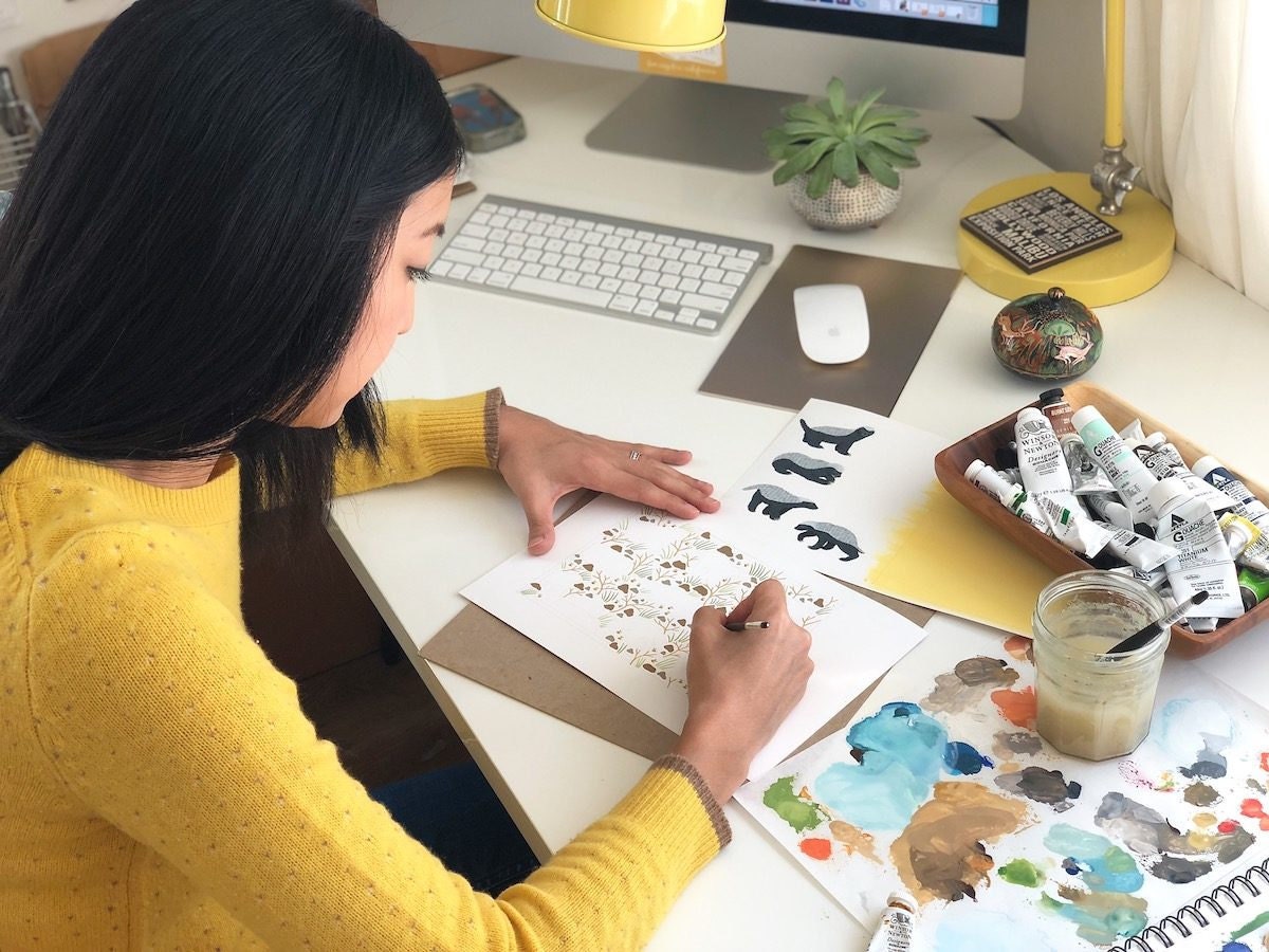 Jen illustrating a card design at her desk