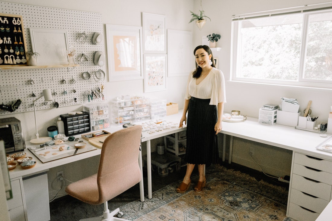 Portrait of jewelry designer Elyse Tolles in her home studio in California
