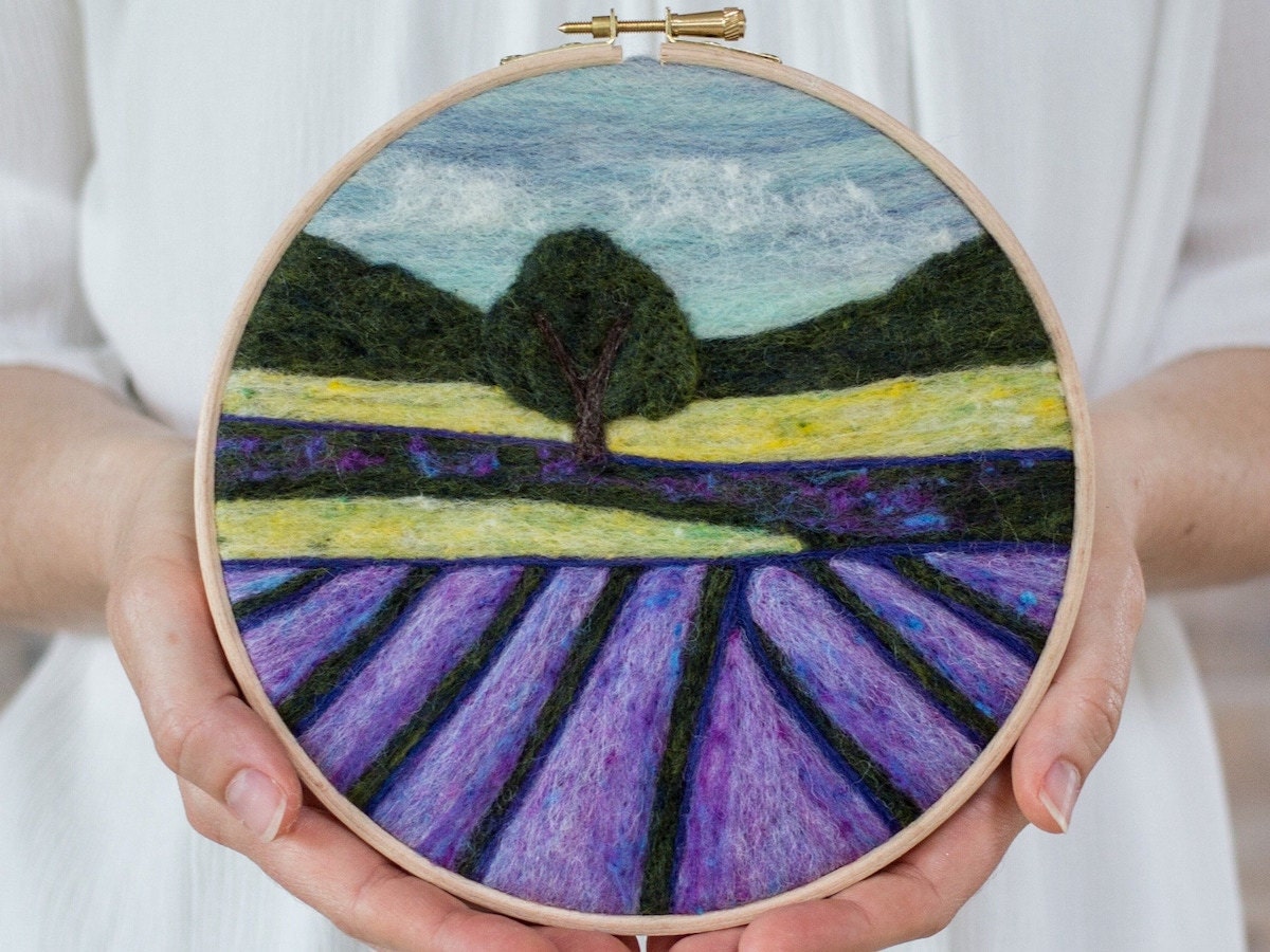 Needle-felted hoop art featuring a lavender field landscape by Felted Sky.