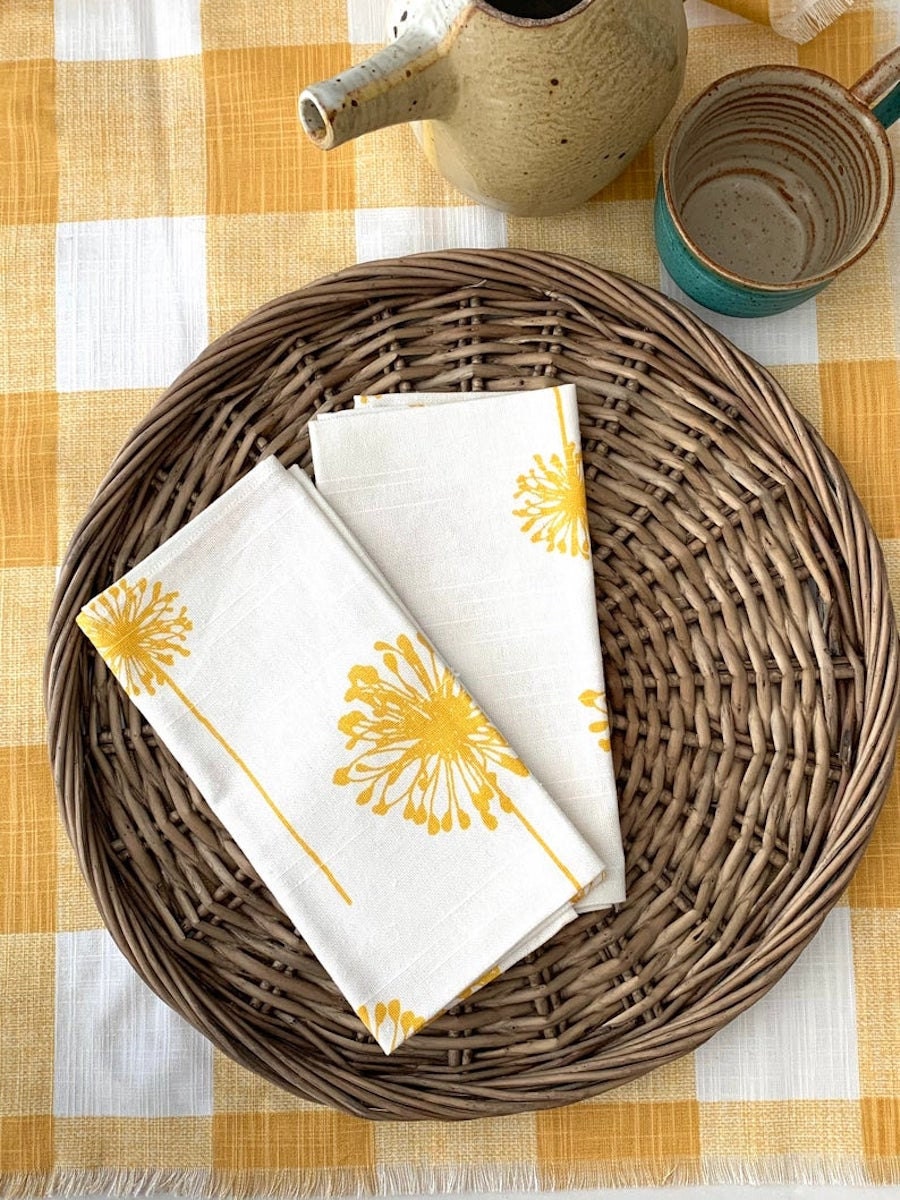 Dandelion dinner napkins from Mesa D’Amore, on sale for summer at Etsy