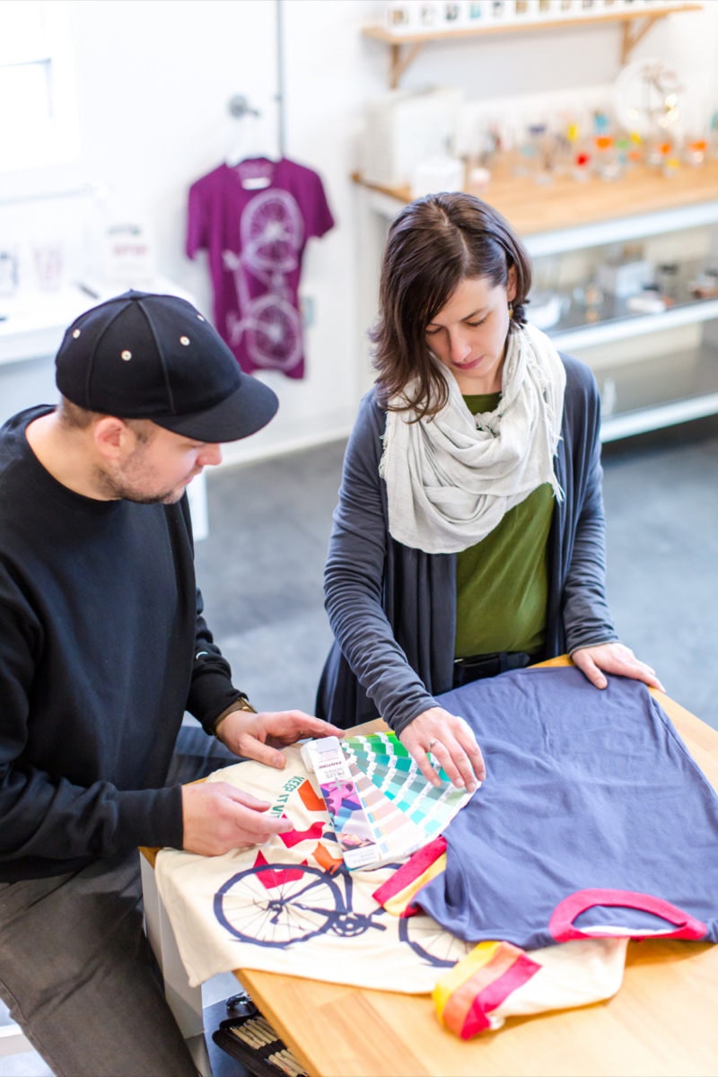 Brett and Crystal discuss color options for a screenprinted T-shirt design.