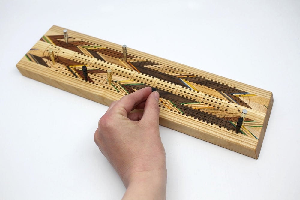A recycled skateboard cribbage board from Adrian Martinus.