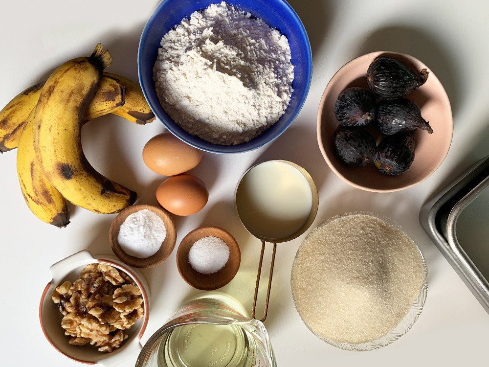 Banana bread ingredients laid out on a table.