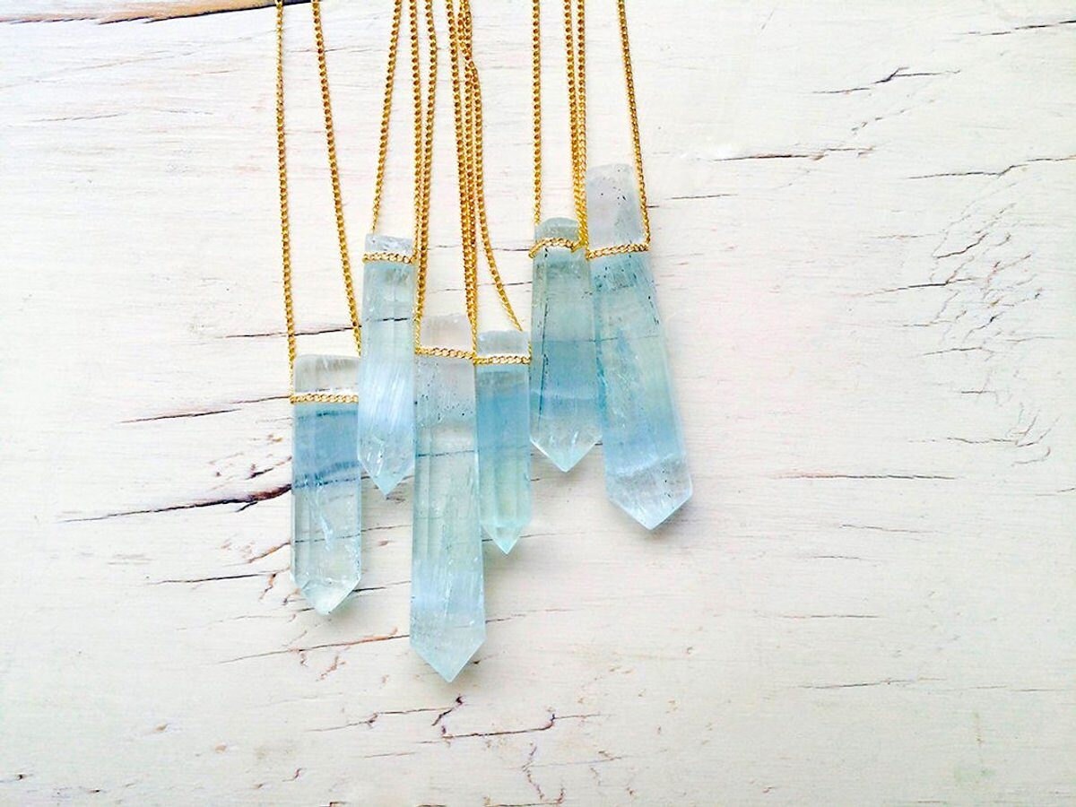 Cluster of six aquamarine pendant necklaces from Robin Woodard