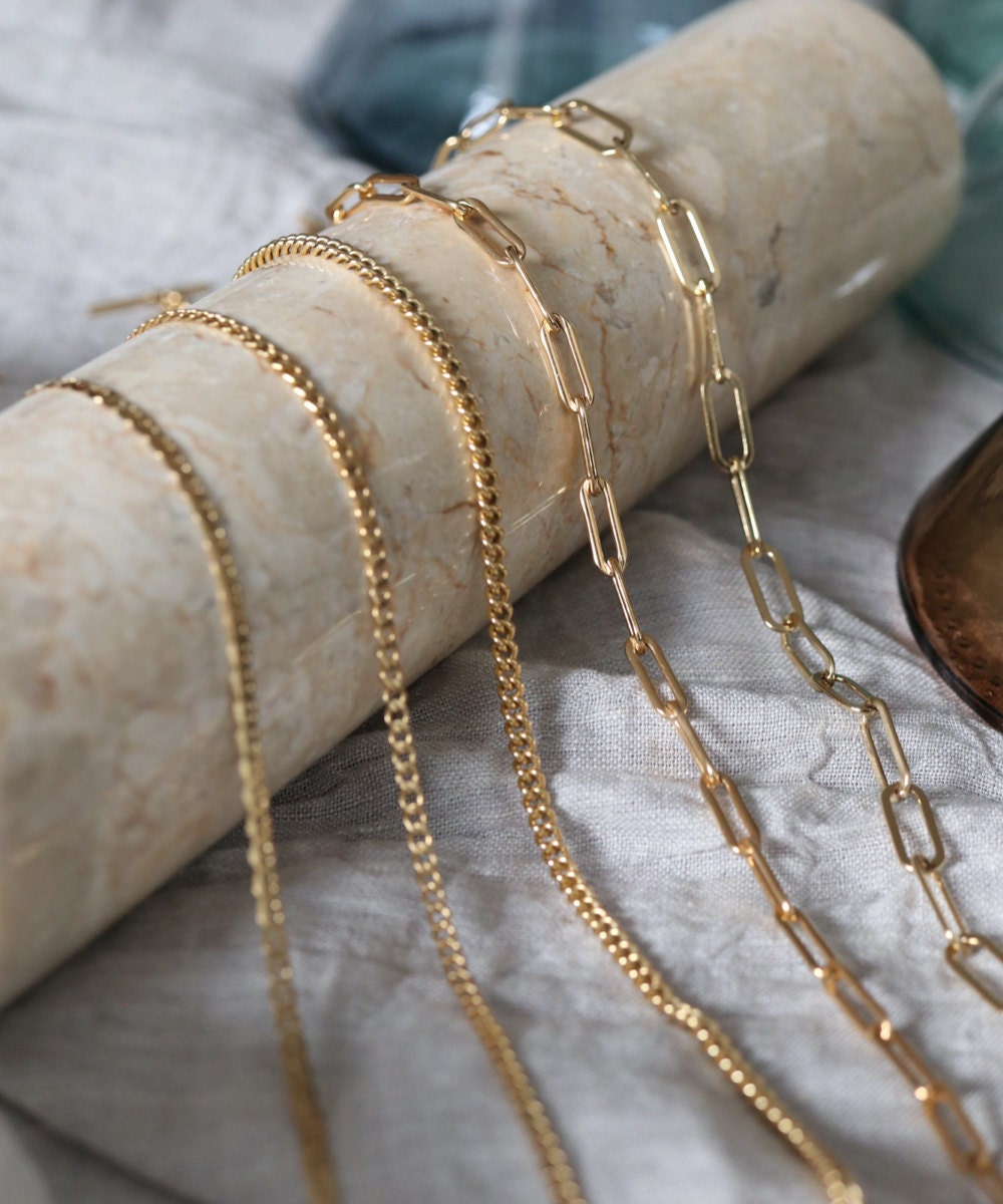 Assorted gold necklace chains from EVREN.