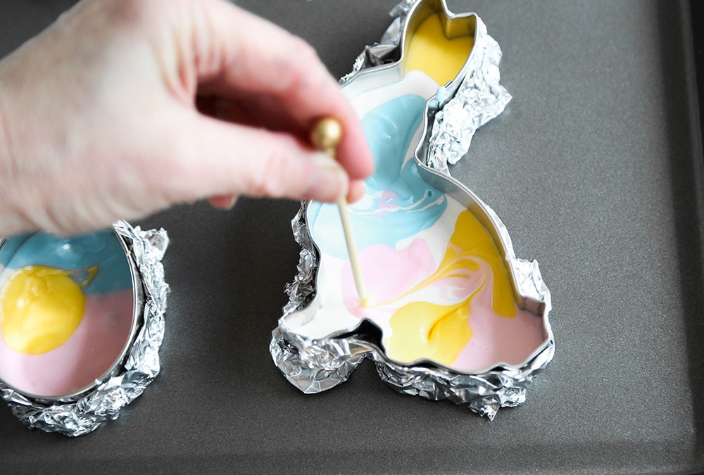 Heather swirls the chocolate with a toothpick to create a marbled effect