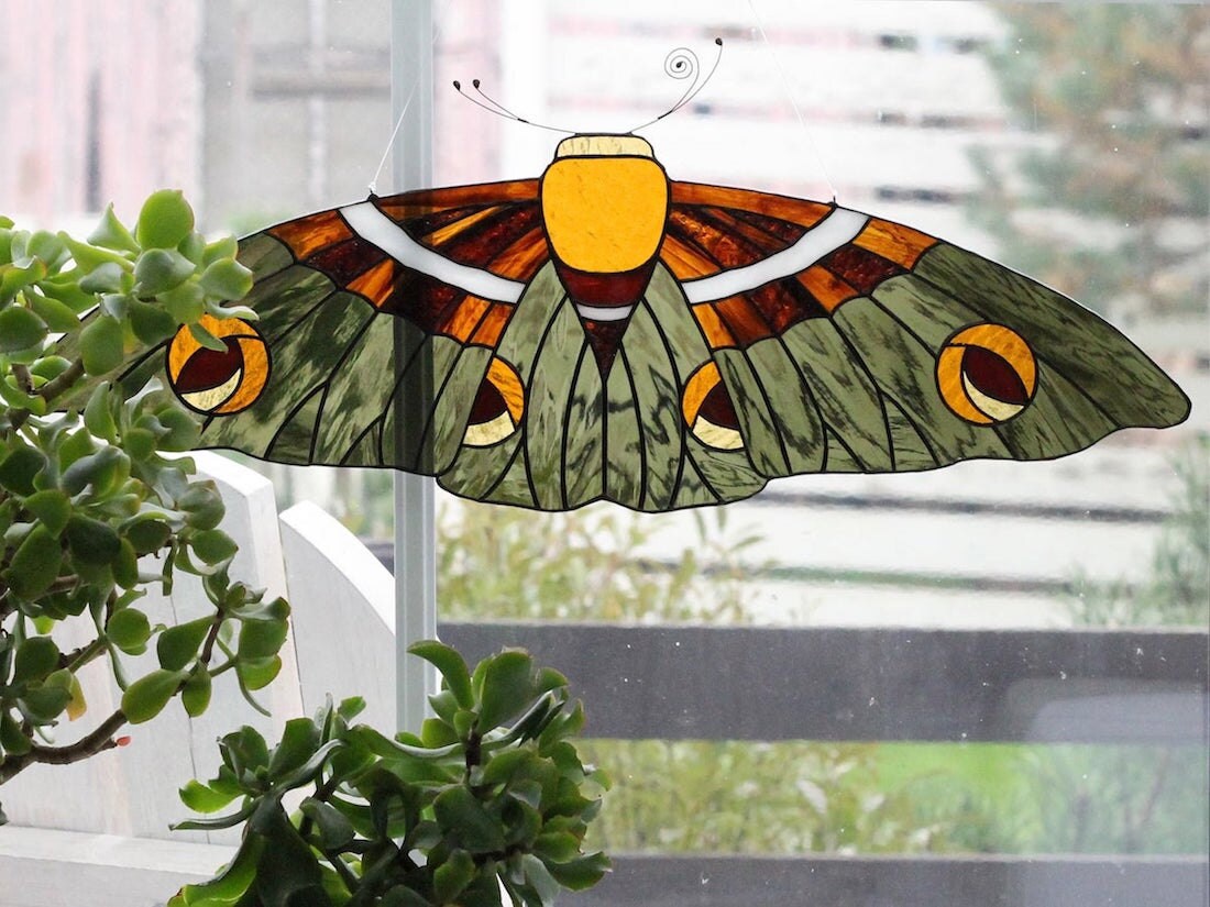 Hanging stained-glass moth suncatcher in olive from Elena Zaycman