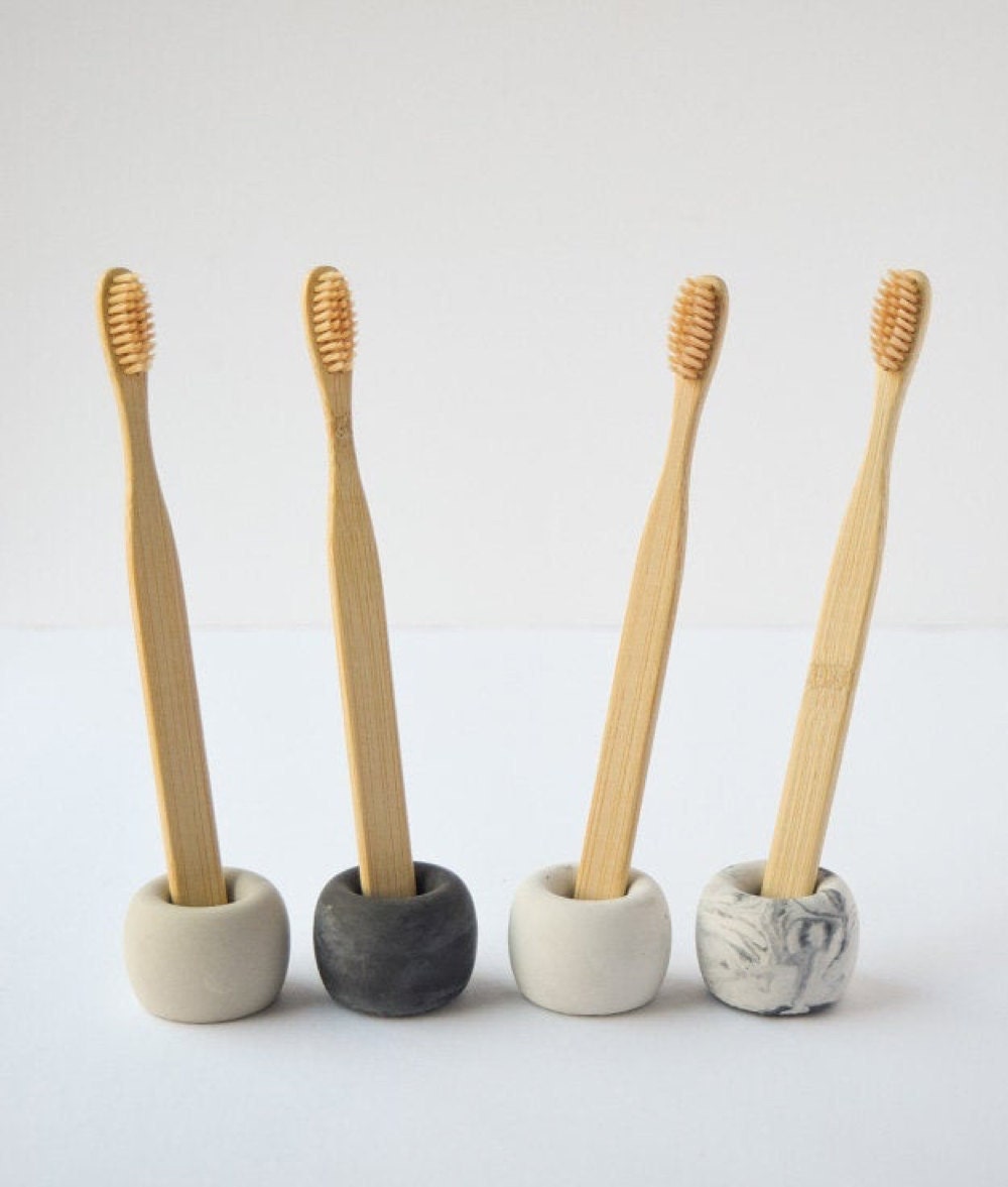 A set of 4 concrete toothbrush holders from Cedar and Stone Garden