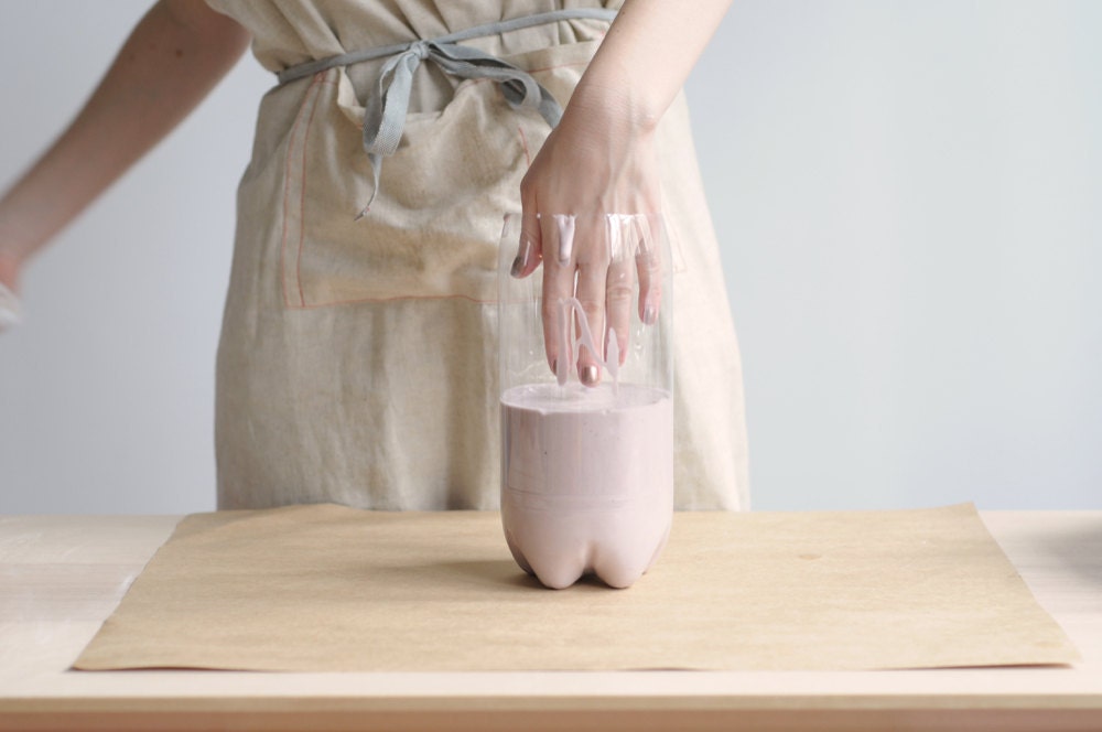 Dipping a hand into the alginate mixture